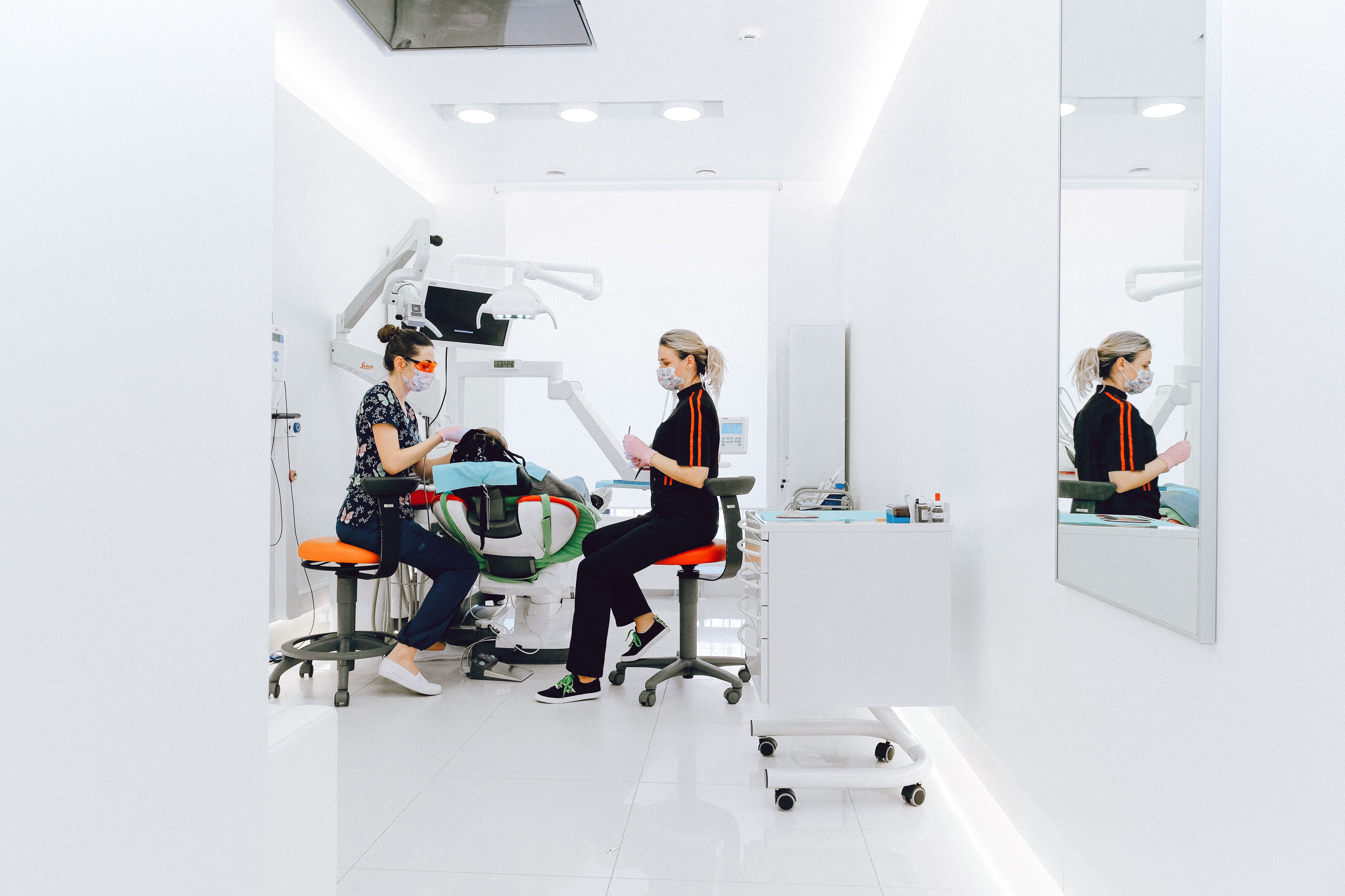 Dental team at a UK practice reviewing a patient's needs in the consultation room